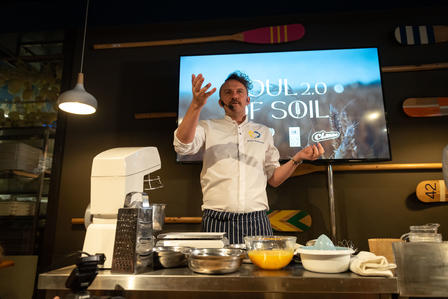 Photograph of Mr. Klopotenko explaining at the event of Soul of Soil