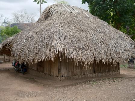 A traditional home in Uma Naruc, Manatuto, where families like Lucia Cabral's once retreated into darkness each evening, their activities constrained by the setting sun. | UNDP BRH/Kapil Das