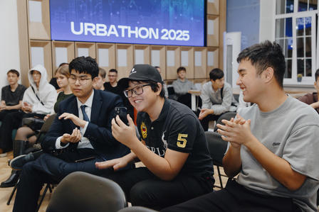 Photograph of attendees seated in a conference room during URBATHON 2025, clapping.