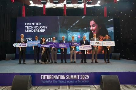 Photograph of a group on stage holding oversized checks at the Future Technology Summit 2025.