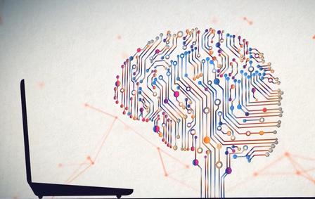 Graphic illustration of a brain with circuits beside a laptop