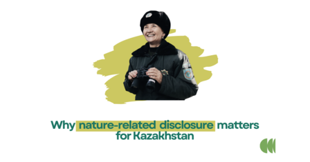 Photo: Speaker in dark coat and black hat beside slide on nature-related disclosure in Kazakhstan