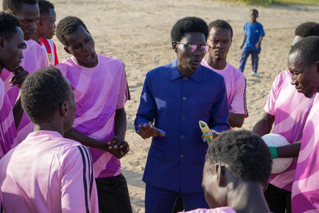 The coach motivating his team at half-time 
