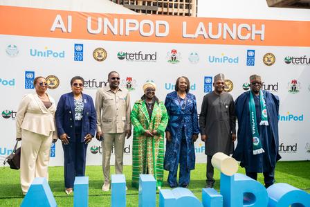 Photograph of diverse people on stage at the AI UNIPOD LAUNCH event.