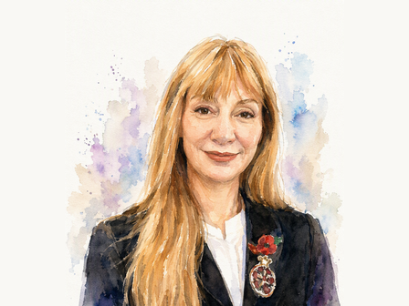 Portrait of a blonde woman in a dark blazer with a rosette pin, watercolor splash background.