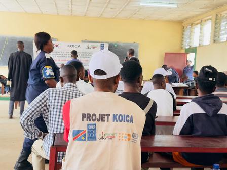 Photograph of a classroom training; foreground person wears a KOICA Project vest.