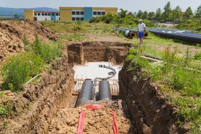 a man standing on a dirt road