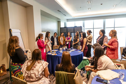 Photo: group of women in a workshop around a table in a bright conference room