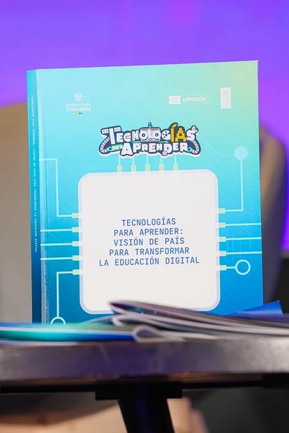 Blue product box with a white label and cartoon graphic on a small display stand, purple backdrop.