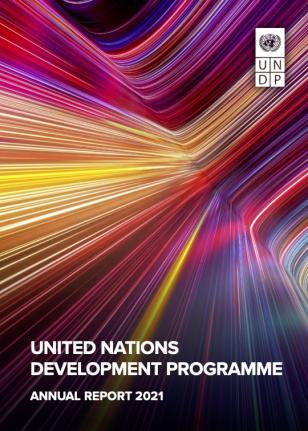 UNDP:n vuosikertomuksen kansikuva jossa abstrakteja lämpimiä värejä.