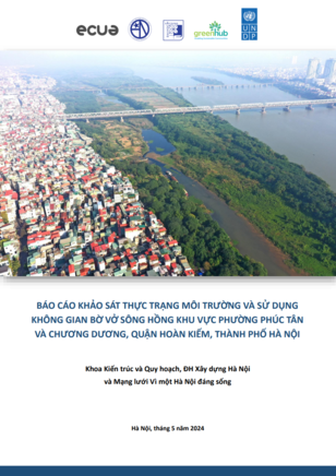 Aerial view of a cityscape with water bodies and green spaces, urban buildings visible.