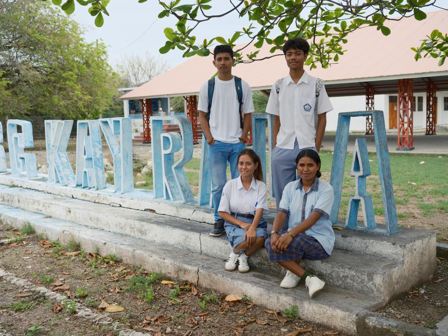 Cláudio Firmino Lay Soares, Alexandrina Pereira Campos, Aurélia Franjo Ximenes Carvalho da Costa, and Natalino Balman dos Reis Soares at ESG Kayrala (left to right) are Grade 11 students who are finally experiencing hands-on computer practice after years of theoretical-only multimedia classes.  | UNDP BRH/Kapil Das